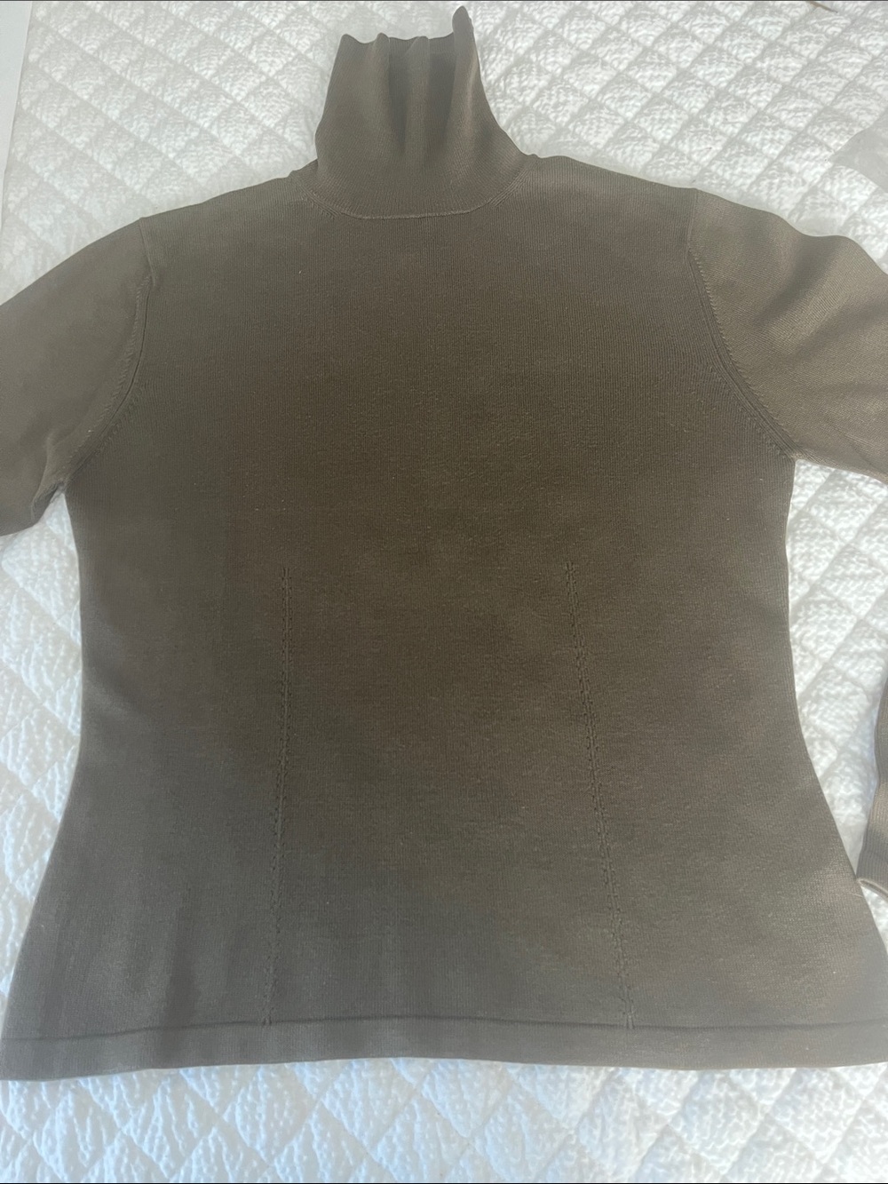 95% silk. Deep olive green. Very Rich looking turtle neck. Perfect for fall!